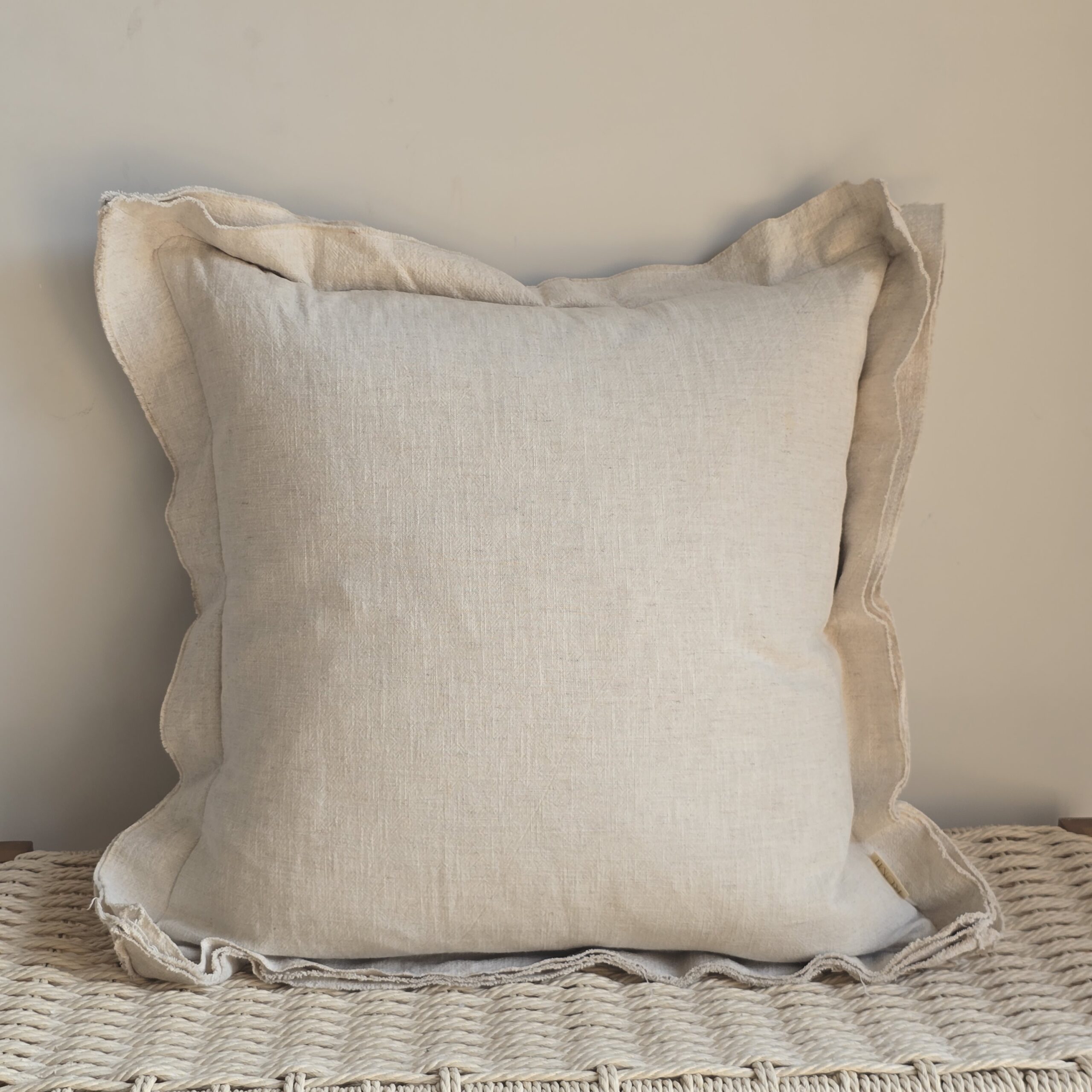 Stonewashed linen cushion with deep triple layered flanged edge in natural heavyweight linen